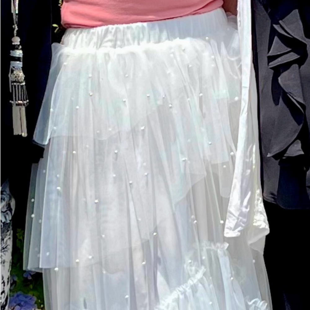 White tulle tea length skirt with pearl detail.